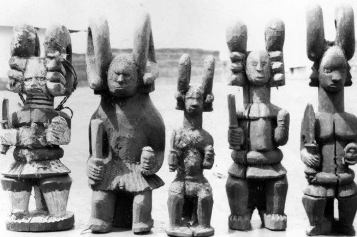 Traditional carved wooden figures and architectural sculpture from southern Nigeria.